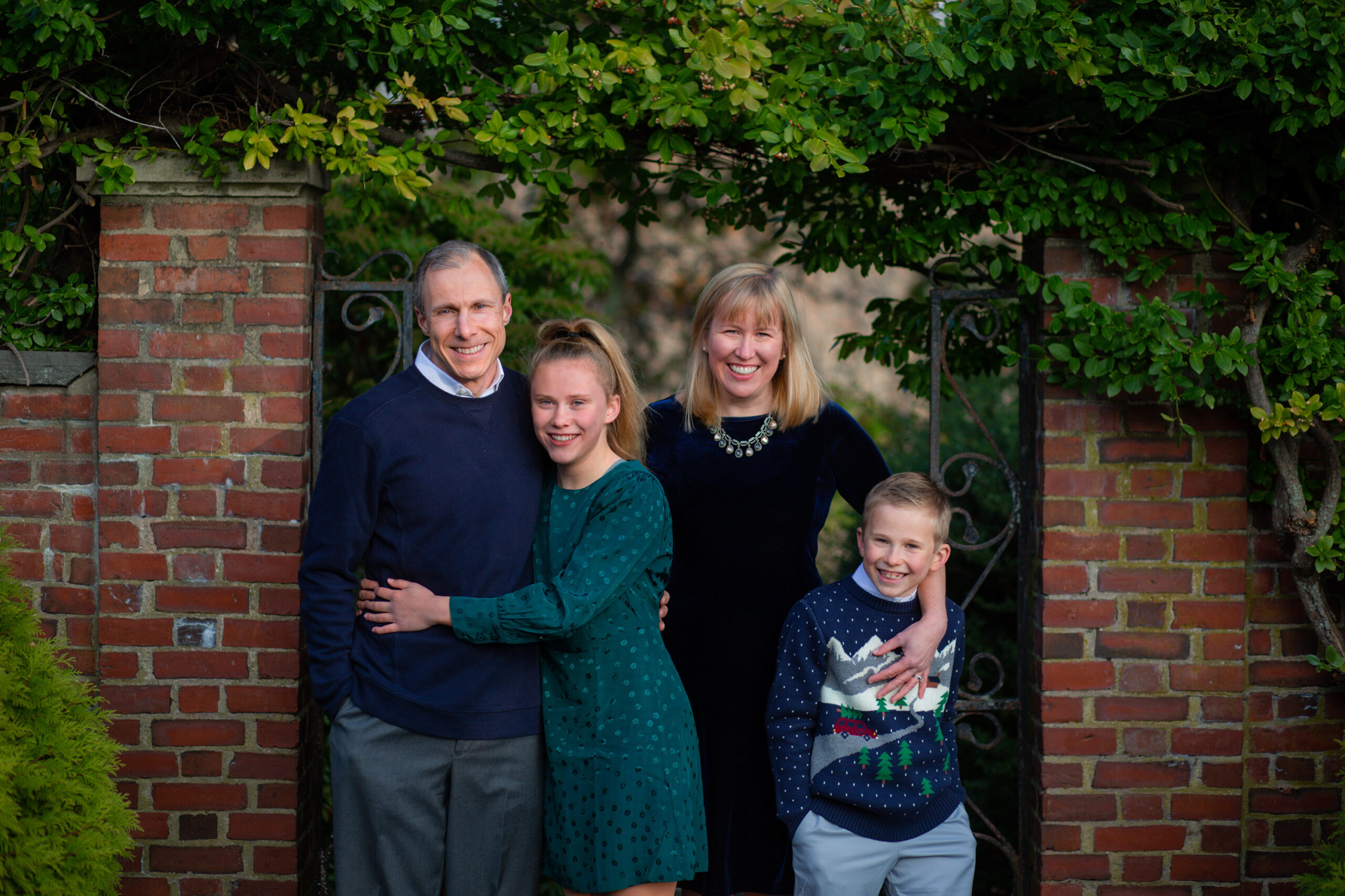 Family Portraits at the North Bridge in Concord, MA in the fall. Photographed by Chiha Portraits.