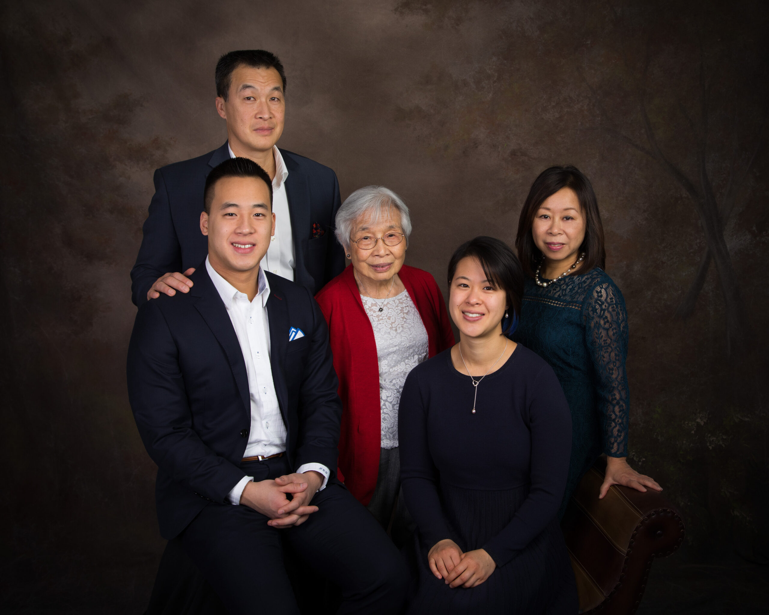 Family Portraits indoors at our photo studio in Concord, MA in the winter. Photographed by Chiha Portraits.