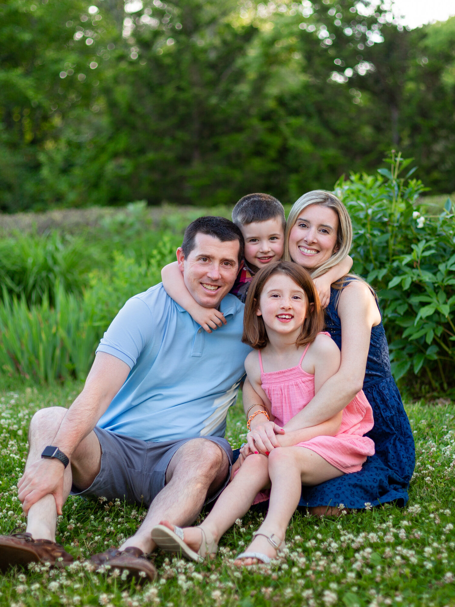 Family Portraits at the North Bridge in Concord, MA in the spring. Photographed by Chiha Portraits.