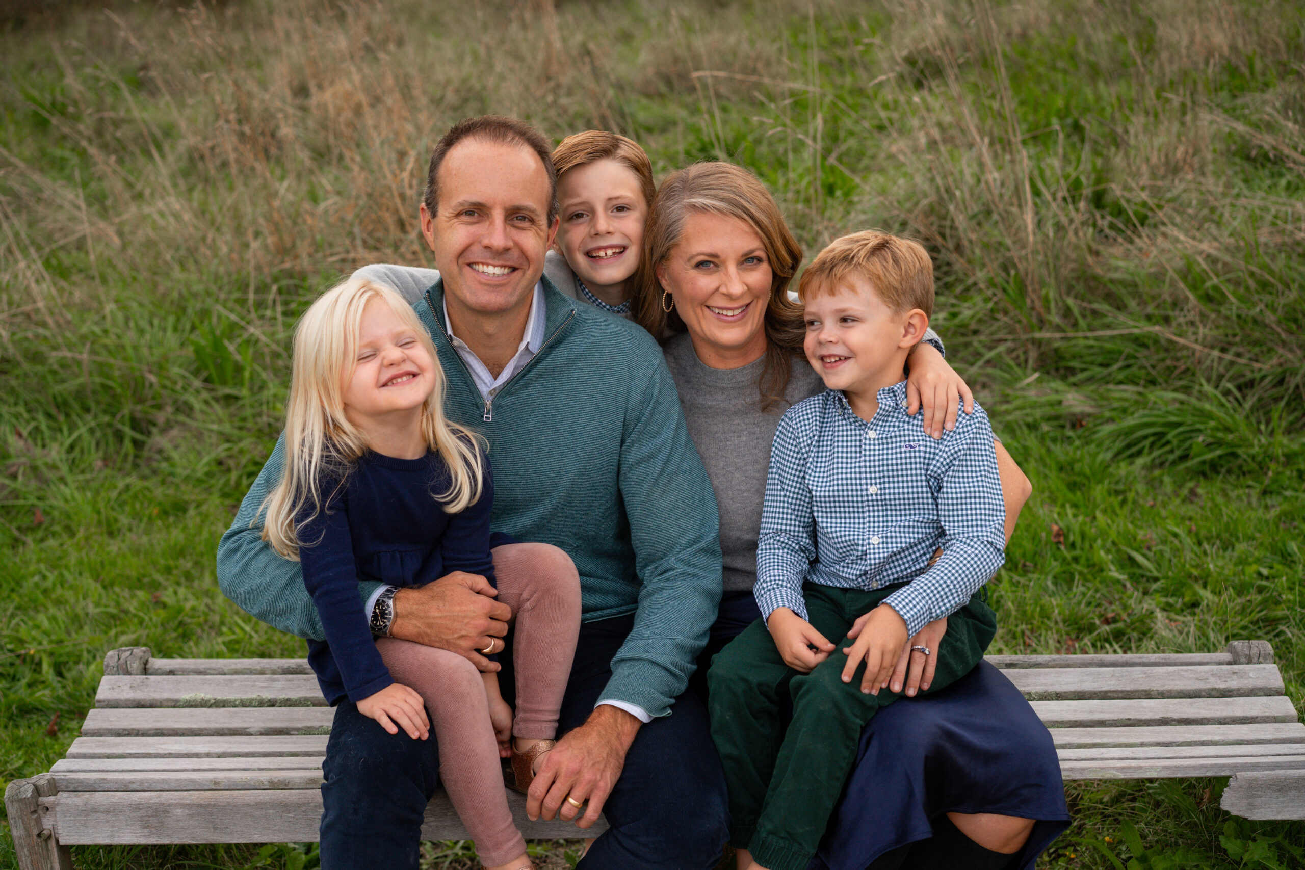 family portraits at the North Bridge in Concord, MA in the fall. Photographed by Chiha Portraits